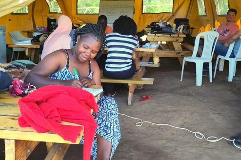 Staff members working on laptops